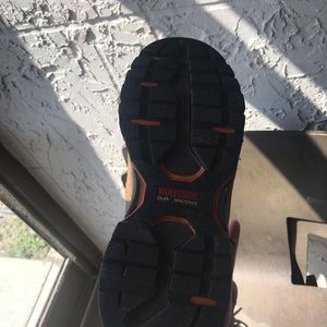 A pair of wolverine dur shocks high top workboot